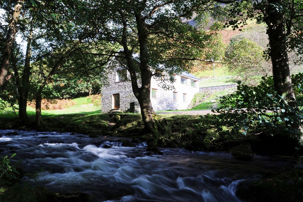 Converted Watermill With Beautiful River And Majestic Mountains On Its Doorstep