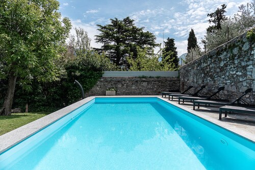 Fabulous villa with private pool set in beautiful garden overlooking the lake   