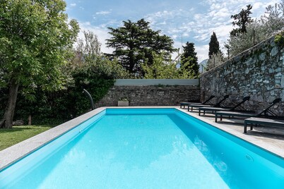 Fabulous villa with private pool set in beautiful garden overlooking the lake   