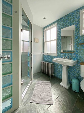Shower, hair dryer, towels, soap