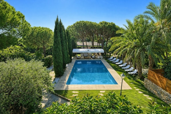 Outdoor pool, a heated pool, sun loungers