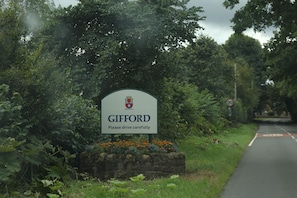 Welcome to Gifford, a charming rural town with a scenic roadside sign.