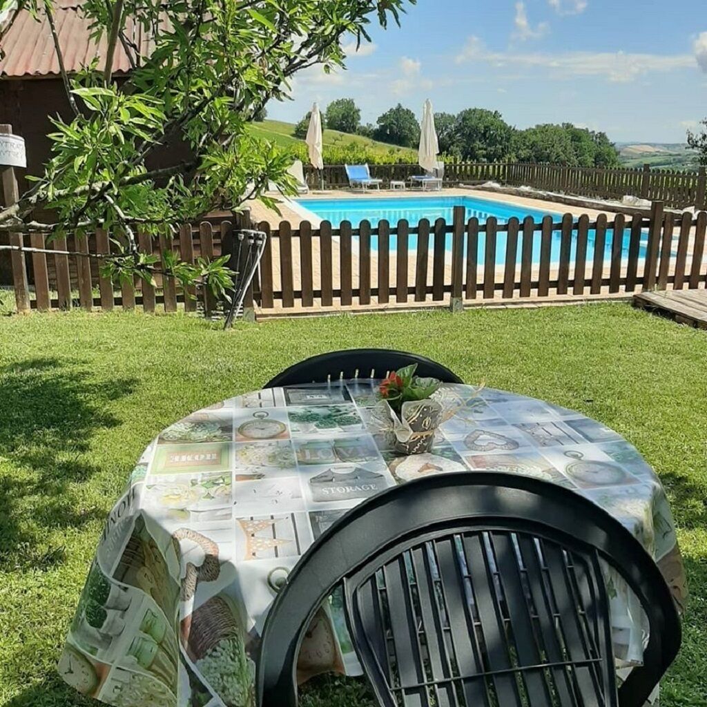 table in the garden for breakfast time with pool view
