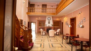 A spacious lobby with a grand staircase, a fireplace, and a clock on the wall. - Domaine La Rosière - Villa for 50 people Indoor swimming pool, Tennis court, Cinema, etc. (Diemeringen)