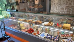A bakery display case with various baked goods and pastries. - Tuscany, an agrotourism apartment between sea and countryside. (Cecina)
