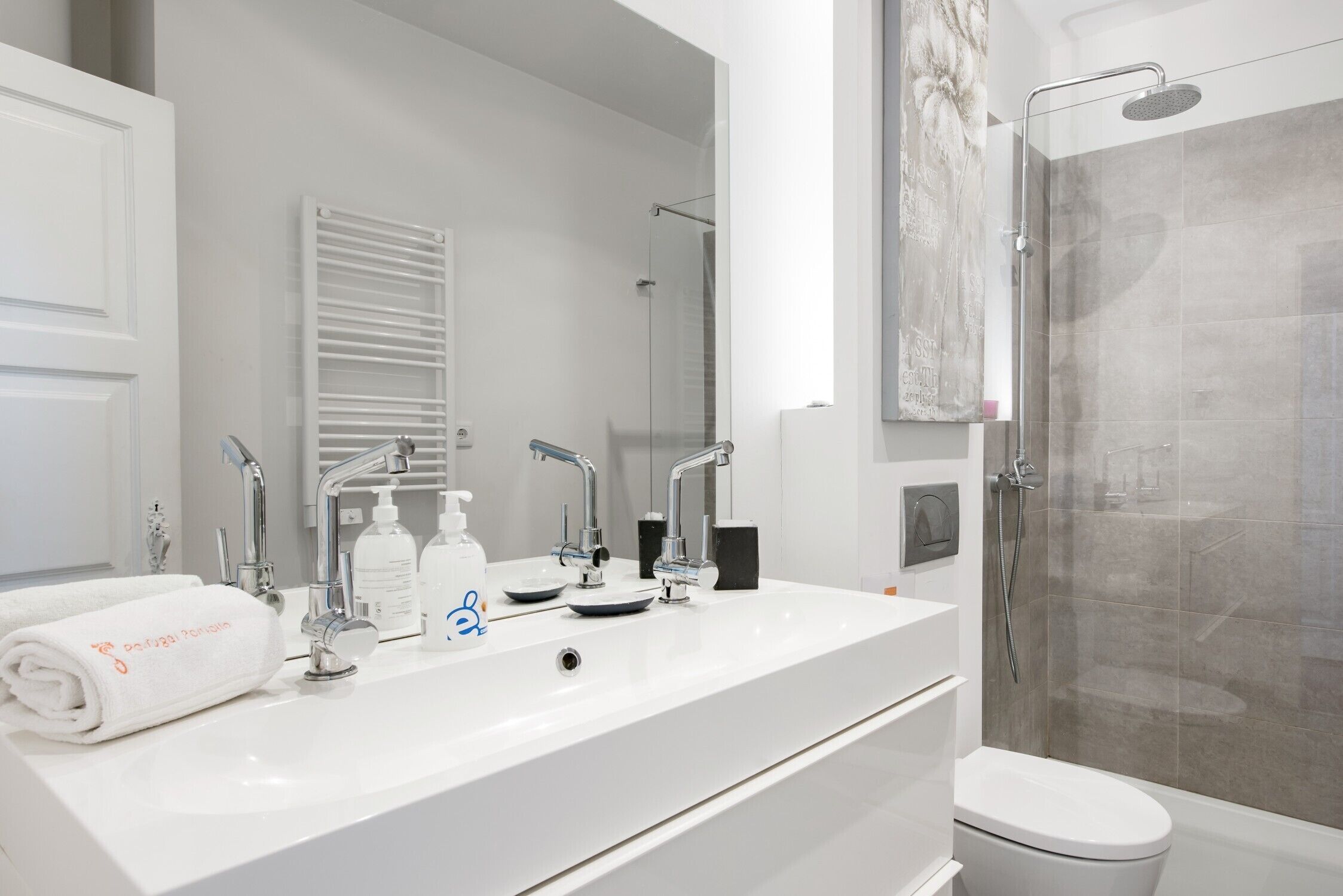 Shower, hair dryer, towels, toilet paper