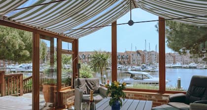 Stunning waterside six-bed house with water views, gardens and private jetty