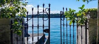 Old luxury villa with garden in front of the Garda lake