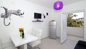 A modern kitchen with a white countertop, a built-in oven, and a refrigerator. - MODERN 1 BEDROOM APARTMENT - 100 mtrs from the beach, free parking, WIFI... (Dubrovnik)