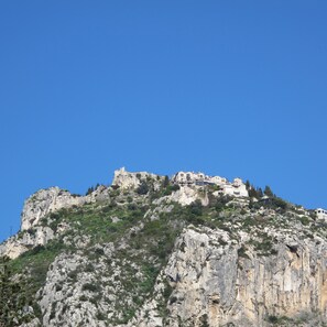 A mountainous area with buildings perched on the cliff.