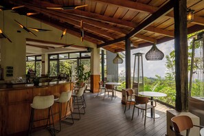 Breakfast, lunch, dinner served; Fusion cuisine, garden views 