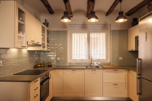 A kitchen with cabinets, a sink, a window, and pendant lighting. - Farmhouse in a nice wine region 40 mins to Barcelona and 25 to Sitges beaches. (Subirats)