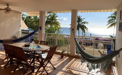 Carbet Apartment on the beach side of standing with your feet in the water