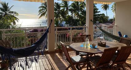Carbet Apartment on the beach side of standing with your feet in the water