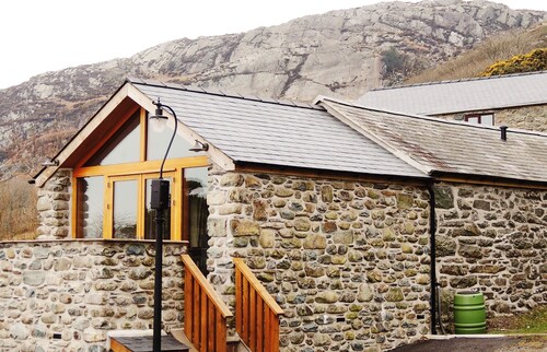 A Sea and Mountain Panorama from this charming stone barn