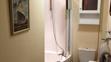 Bathtub, hair dryer, towels, soap
