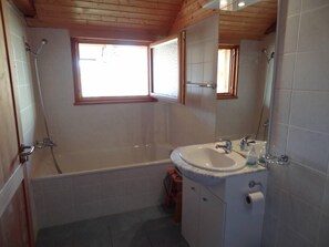 Bathtub, hair dryer, towels