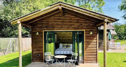Buckstone Log Cabin with Private Grounds Nestled Into The Natural Woodland