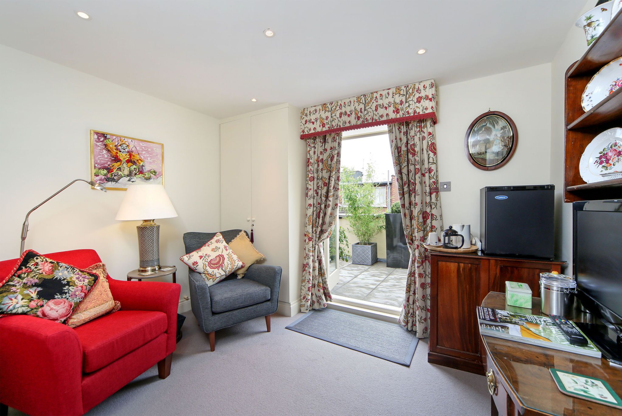 Comfortable double bedroom with ensuite bathroom, sitting room & roof terrace
