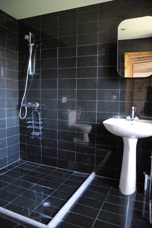 Bathtub, towels, soap, toilet paper