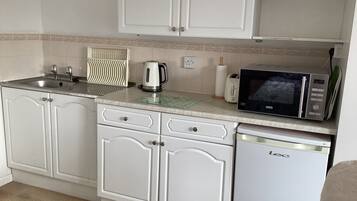 Fridge, microwave, electric kettle, toaster