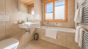 Bathtub, hair dryer, towels