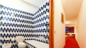 A bathroom with a blue and white wavy tile pattern, a white toilet, and a bidet. - Autonomous snow outing, 5 beds! <br>Private exit to the snow, 5 beds! (Breuil-Cervinia)