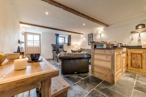 Open plan kitchen, dining, living area.