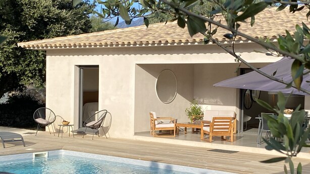 A poolside area with a wooden deck, a pool, and a small building with a door and seating area. - Big house  with garden (Sotta)
