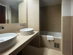 Bathtub, hair dryer, towels