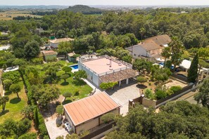 An aerial view of a residential area with multiple houses, a swimming pool, and lush greenery. - SON FORTEZA Villa for 4 with pool in Crestatx Pollensa (Sa Pobla)