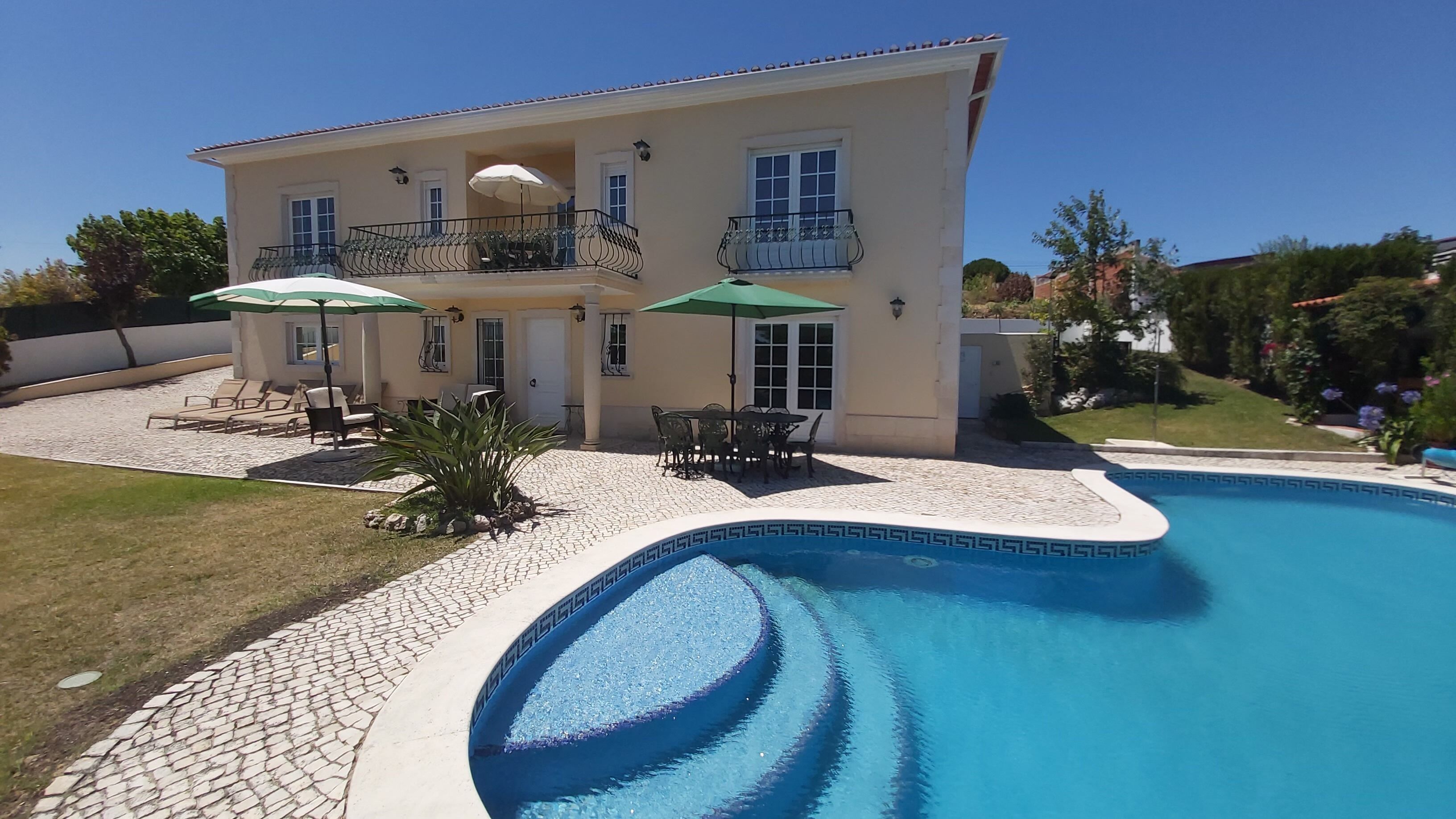 Front view of house and pool