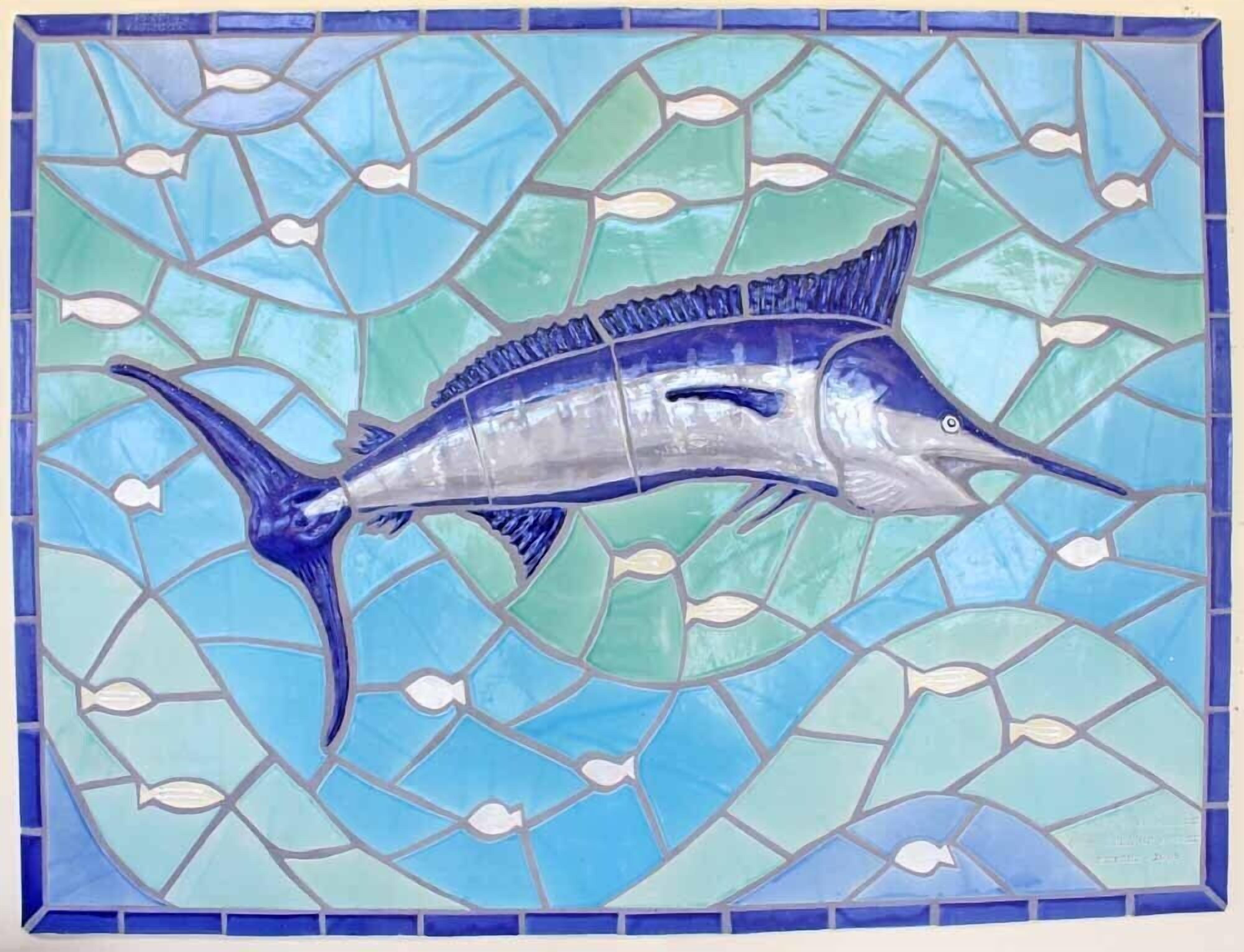 A mosaic tile with a fish design.