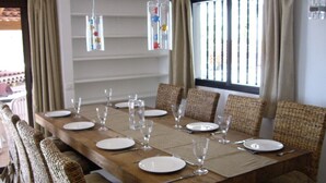 A dining table set for six with wicker chairs, a wooden table, and hanging glass candle holders. - Prime Location, Htd Pool, Breathtaking Sea Views nr Beach/Marina, A/C WiFi UKTV (Los Gigantes)