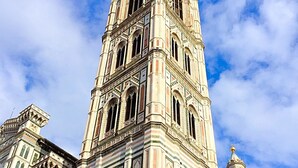 A historic building with intricate architectural details and a prominent tower. - SMART APT CLOSE TO PITTI PALACE IN THE OLD CENTER OF OLTRARNO (firenze)