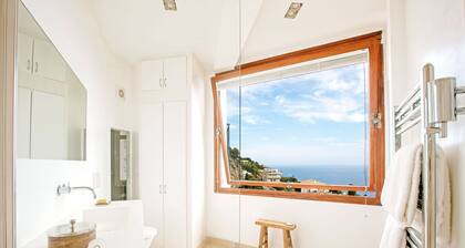 Luxury villa apartment with panoramic sea views and small private garden