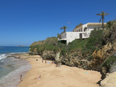An air-conditioned villa, set in a large garden, on the first line of the beach