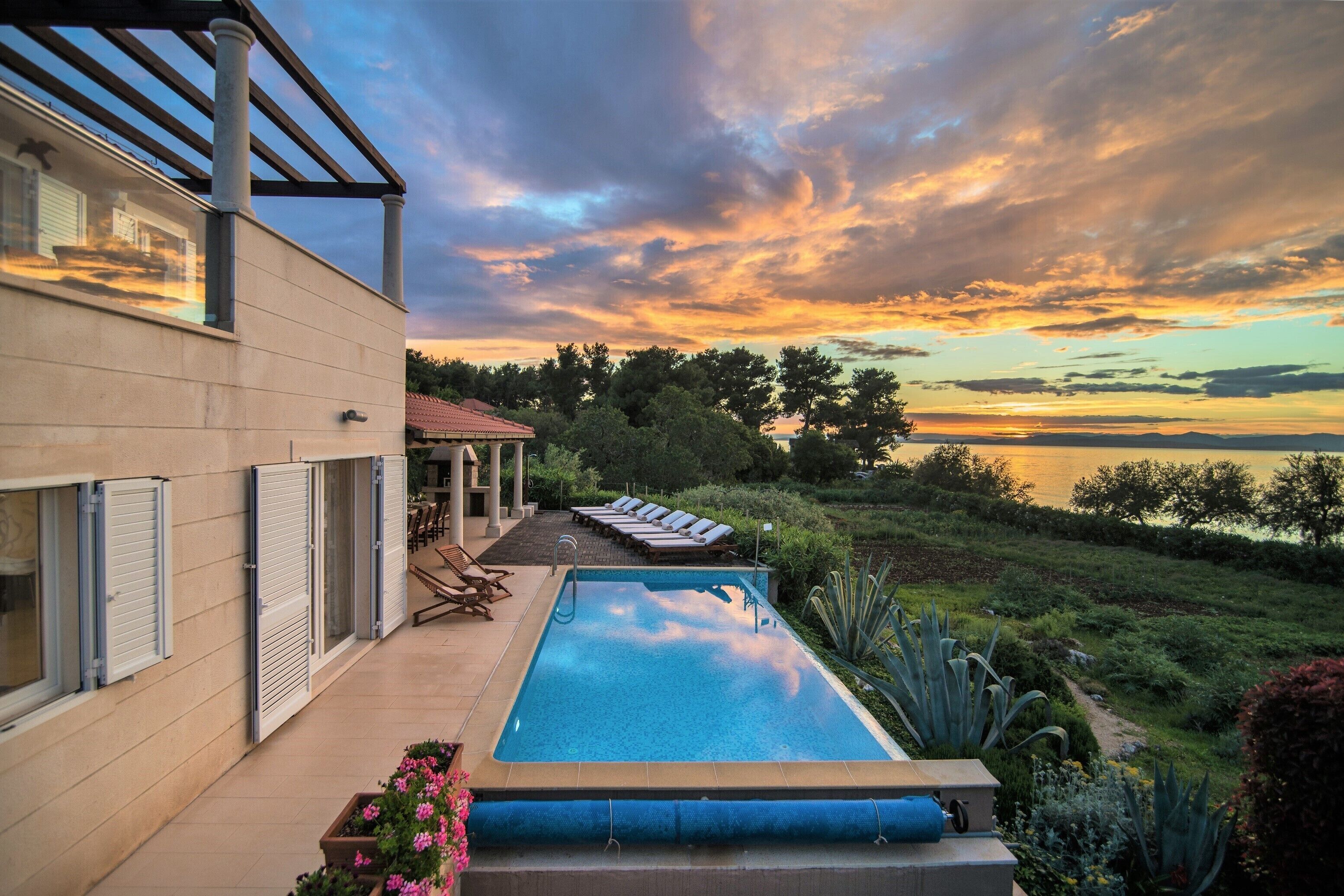 Outdoor pool, a heated pool, sun loungers