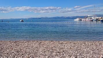 On the beach, sun loungers, beach towels