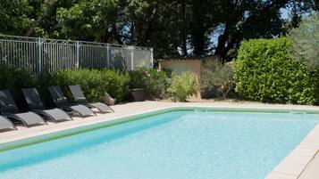 Outdoor pool, a heated pool, sun loungers
