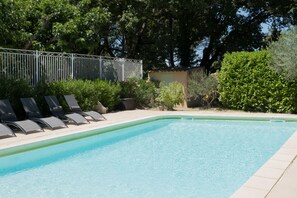 Outdoor pool, a heated pool, sun loungers