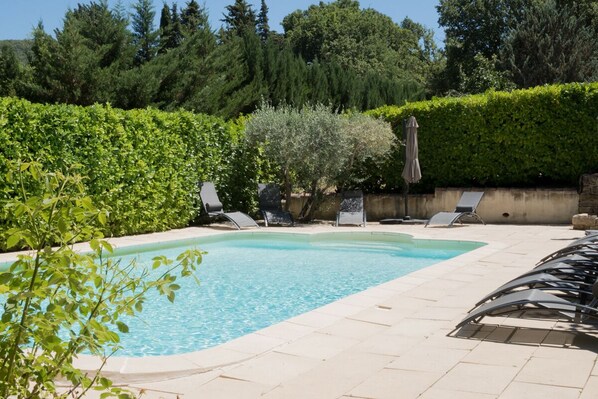 Outdoor pool, a heated pool, pool loungers