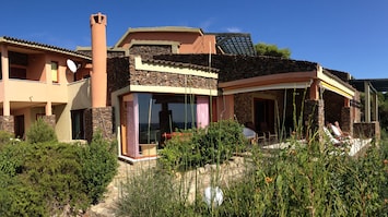 Front view with some details: main terrace and living room panoramic window