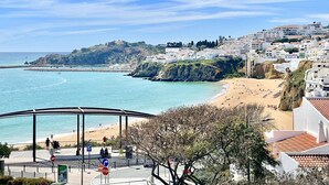 A coastal town with a beach, a pier, and buildings on a hillside. - 3 bedroom Villa, Private Pool, Private Location. Close to Guia, Near Albufeira Beaches & Old Town. (Guia)