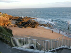 On the beach, sun-loungers