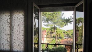 A window with a view of a garden and buildings. - Villa in Platja de Pals near Begur (Costa Brava) (Pals)