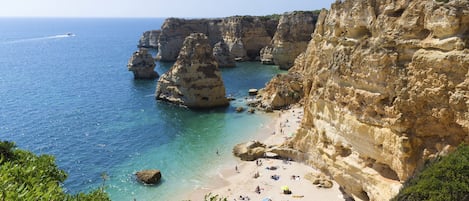 On the beach, sun loungers, beach towels