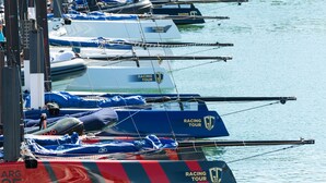 A marina with several boats docked, some with racing tour branding. - Oceanside modern apartment [80] (Lagos)