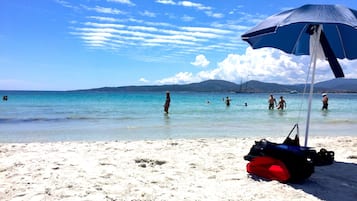 On the beach, sun-loungers