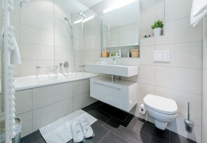 Bathtub, hair dryer, towels